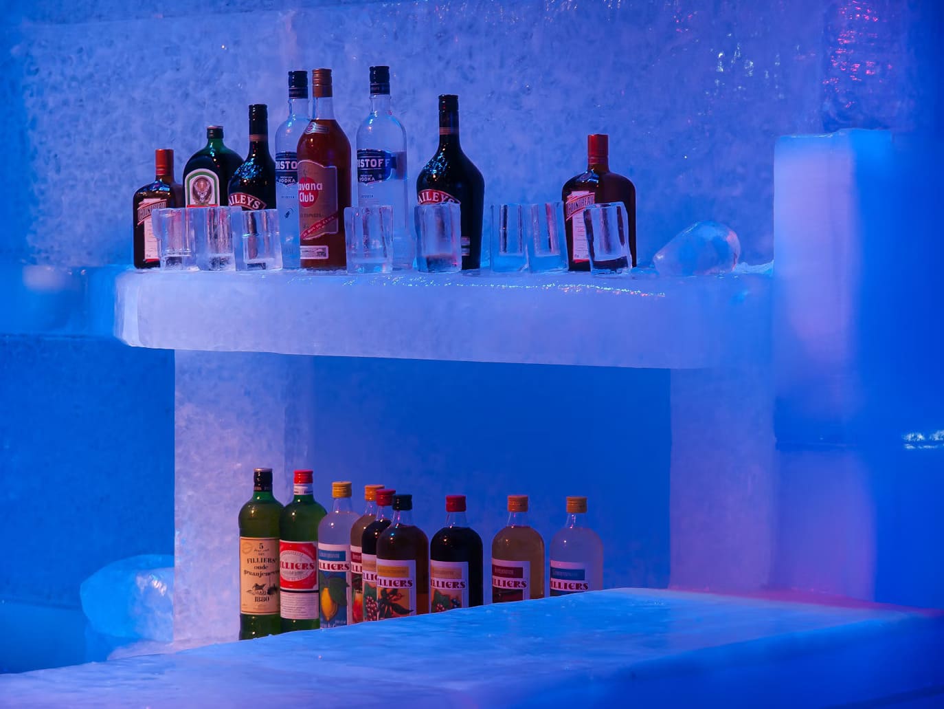 ice bar with various drinks on the shelves