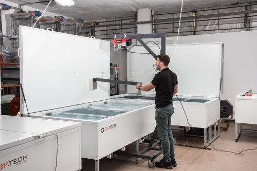 man working with ice block maker